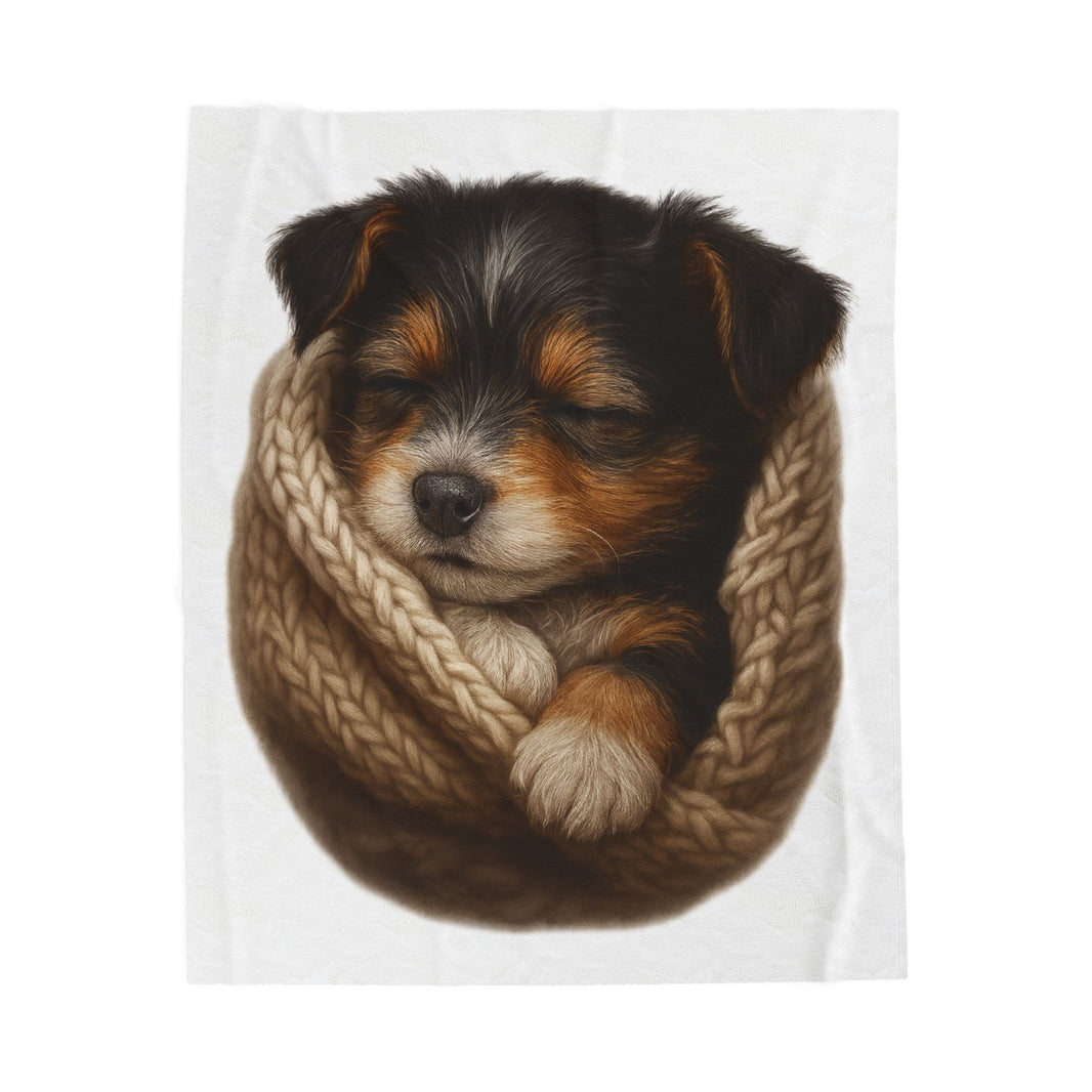 Blanket with Puppy wrapped in a knitted blanket on a white background