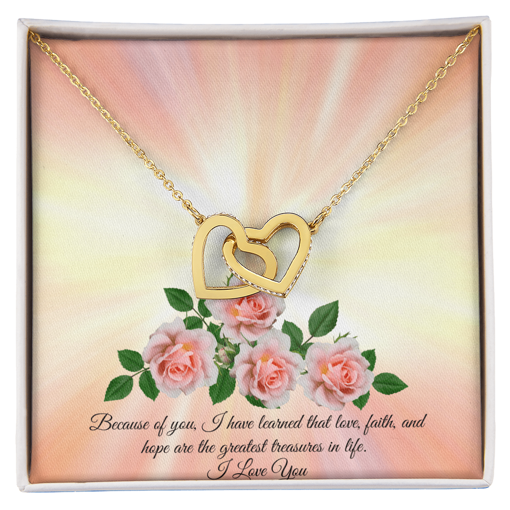 An interlocking hearts necklace with sparkling hearts and rose gold or 18k yellow gold finish, presented in a box with a message card.