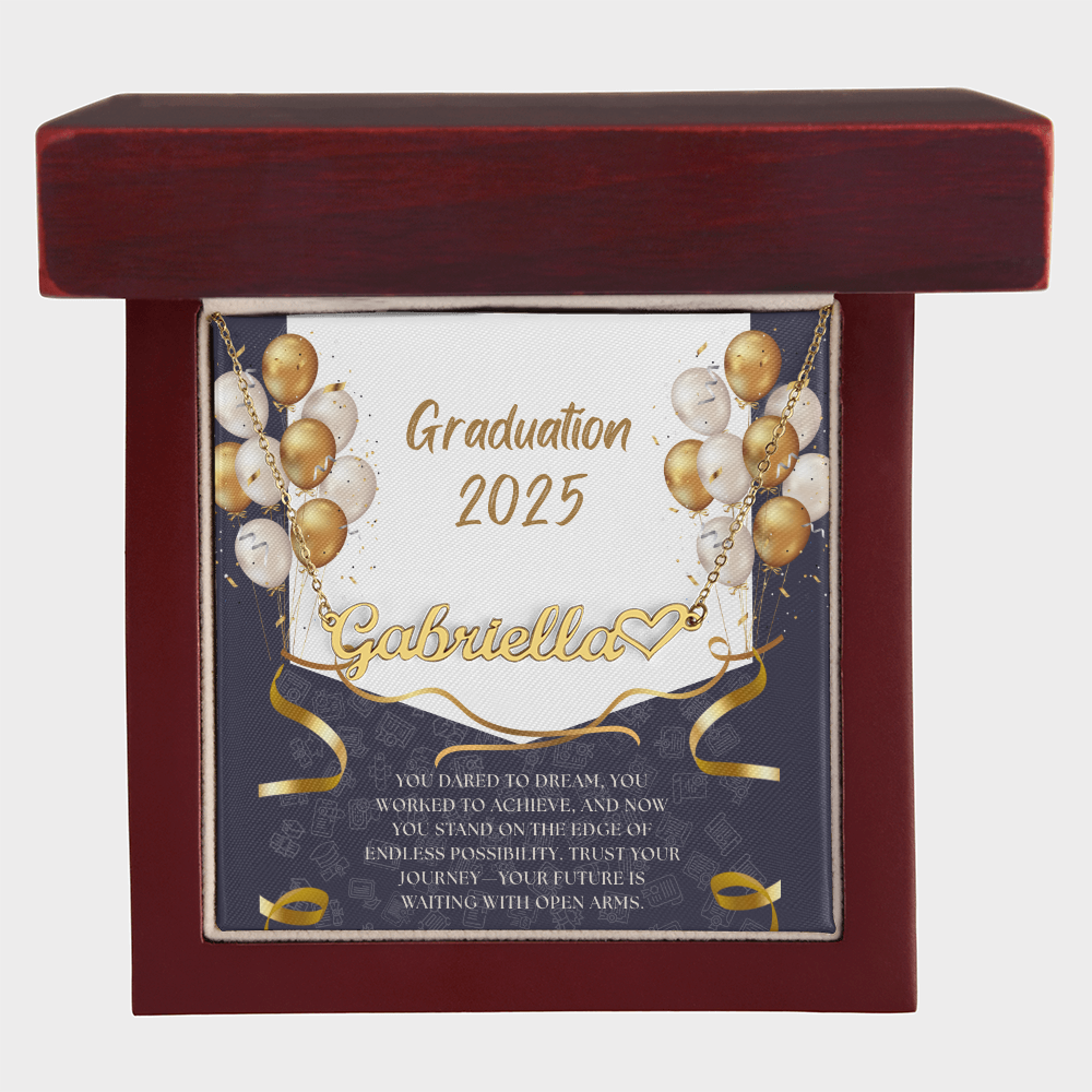Close-up of hands holding an open red gift box featuring a personalized gold name necklace with heart, set against a message card that reads "Graduation 2025" and includes an inspiring graduation quote, with gold and white balloons in the background.