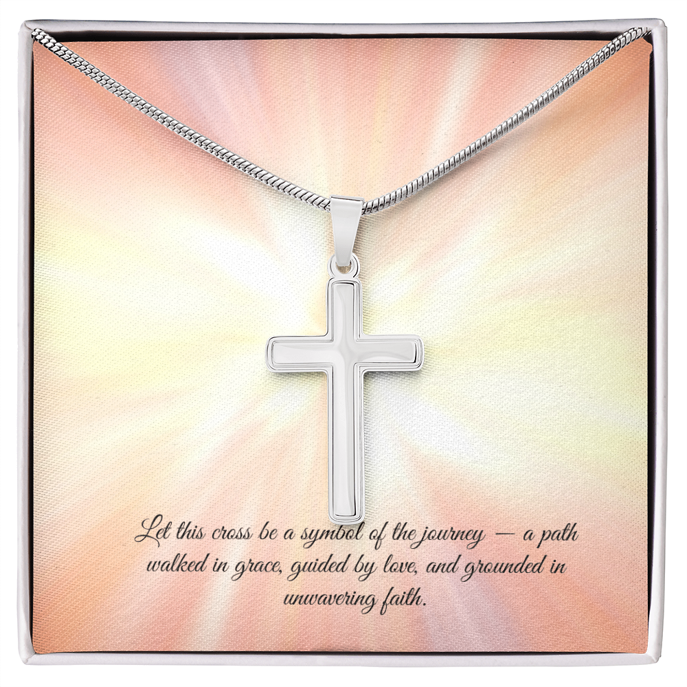 Silver cross necklace displayed in a red gift box with a radiant background and an inspirational message that reads: 'Let this cross be a symbol of the journey — a path walked in grace, guided by love, and grounded in unwavering faith