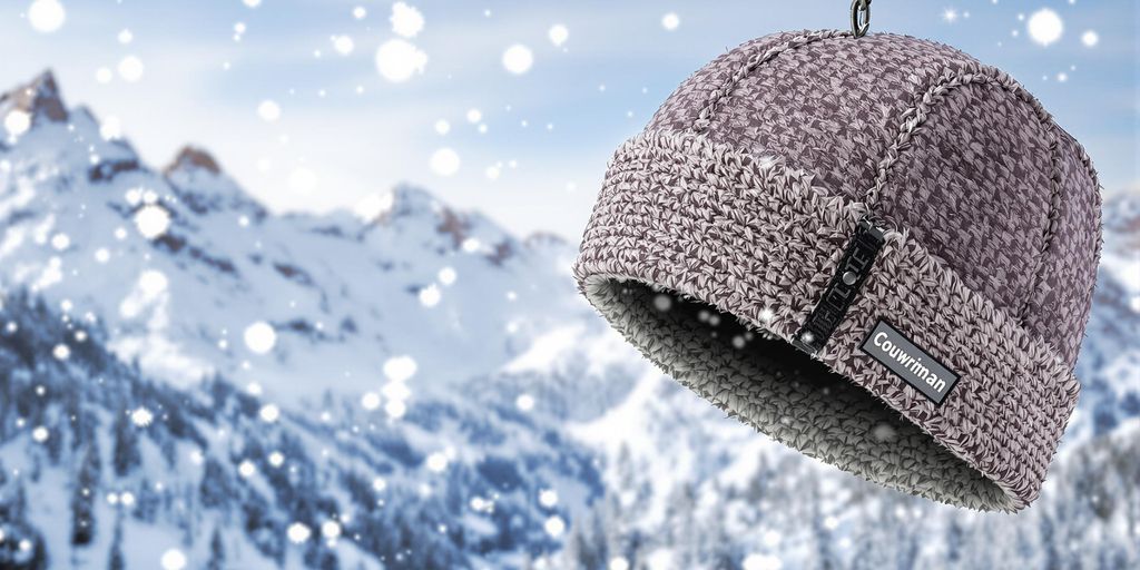 Warm winter hiking cap against a snowy mountain backdrop.
