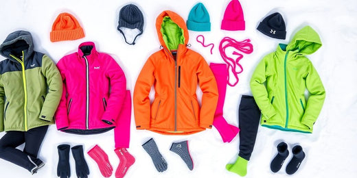 Colorful winter exercise clothing on snow background.