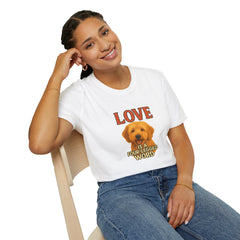 Person wearing a white t-shirt with a dog graphic and text, sitting on a chair.