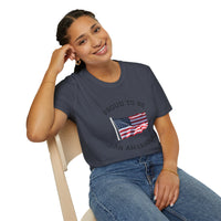 Smiling woman  wearing a white t-shirt with an American flag graphic and the words 'Proud to Be an American' printed around the flag