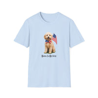 T-shirt featuring a cute golden doodle puppy wearing an American flag bow tie and holding a small U.S. flag, with the phrase 'Born to Be Free' printed below the image.