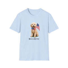 T-shirt featuring a cute golden doodle puppy wearing an American flag bow tie and holding a small U.S. flag, with the phrase 'Born to Be Free' printed below the image.