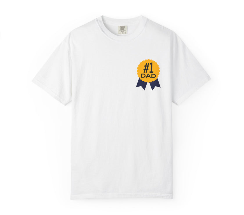 White t-shirt featuring a yellow and navy blue award ribbon graphic on the chest with the text "#1 Dad," designed as a fun and heartfelt Father's Day gift.