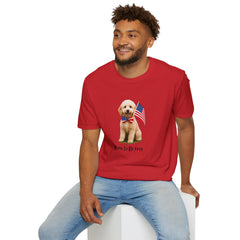 Male wearing T-shirt featuring a cute golden doodle puppy wearing an American flag bow tie and holding a small U.S. flag, with the phrase 'Born to Be Free' printed below the image.