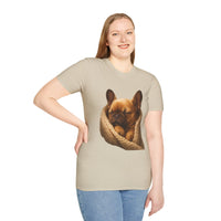 Person wearing a beige t-shirt with a dog graphic on a white background