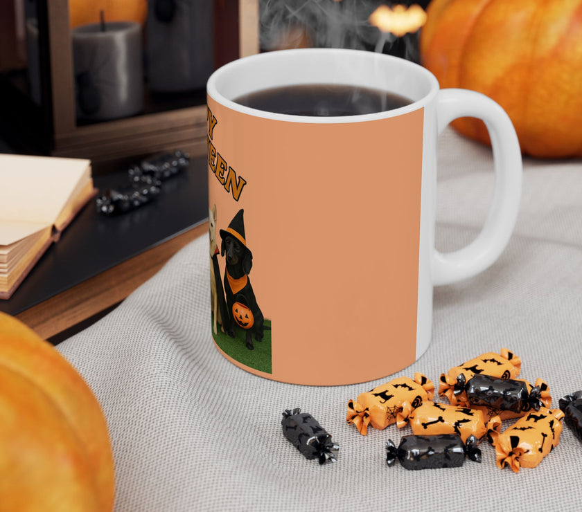 Halloween-themed mug with a dog in a witch costume, surrounded by pumpkins and treats on a table.