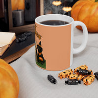 Halloween-themed mug with a dog in a witch costume, surrounded by pumpkins and treats on a table.