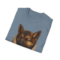 Folded blue t-shirt with a dog graphic on a white background
