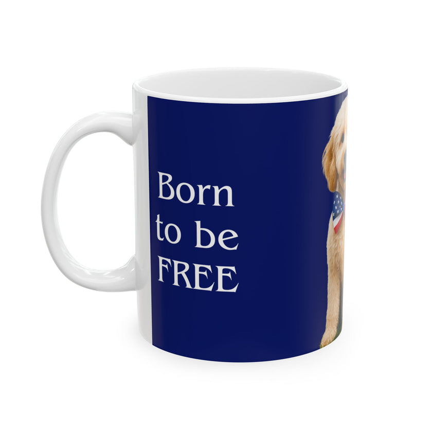 A ceramic mug featuring aGoldendoodle sitting on grass, wearing a red, white, and blue bow tie, and holding an American flag against a dark blue background. with the message "Born to be Free"  side view