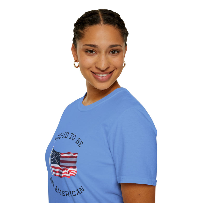 Smiling woman  wearing a white t-shirt with an American flag graphic and the words 'Proud to Be an American' printed around the flag