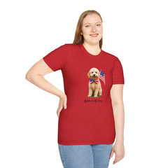 Female wearing T-shirt featuring a cute golden doodle puppy wearing an American flag bow tie and holding a small U.S. flag, with the phrase 'Born to Be Free' printed below the image.
