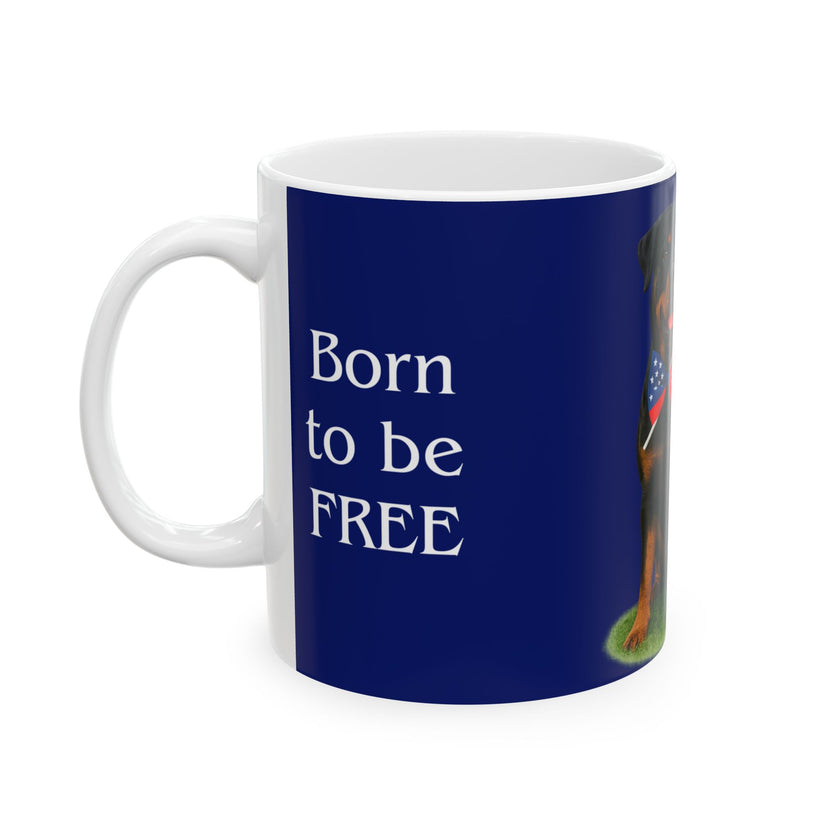 A ceramic mug featuring a Rottweiler sitting on grass, wearing a red, white, and blue bow tie, and holding an American flag against a dark blue background. with the message "Born to be Free"
