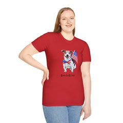 Female wearing T-shirt featuring a cute  puppy wearing an American flag bow tie and holding a small U.S. flag, with the phrase 'Born to Be Free' printed below the image.