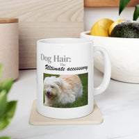 White ceramic mug featuring a photo of dogs lying on grass, with the humorous quote "Dog Hair: The Ultimate Accessory" printed below the image.