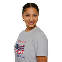Female wearing T-shirt featuring an American flag graphic with the words 'AMERICAN DREAM' in red and blue text above and below the flag