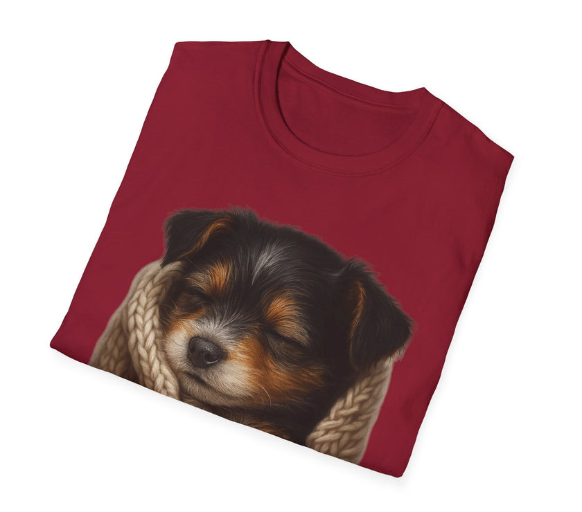 Folded red t-shirt with a puppy design on a white background