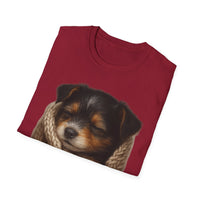 Folded red t-shirt with a puppy design on a white background
