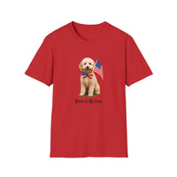 T-shirt featuring a cute golden doodle puppy wearing an American flag bow tie and holding a small U.S. flag, with the phrase 'Born to Be Free' printed below the image.