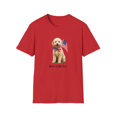 T-shirt featuring a cute golden doodle puppy wearing an American flag bow tie and holding a small U.S. flag, with the phrase 'Born to Be Free' printed below the image.