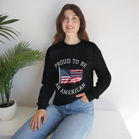 Person wearing a black sweatshirt with 'Proud to be an American' text and flag design, sitting on a white surface with a plant in the background.