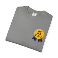 Gray t-shirt featuring a yellow and navy blue award ribbon graphic on the chest with the text "#1 Dad," designed as a fun and heartfelt Father's Day gift.

