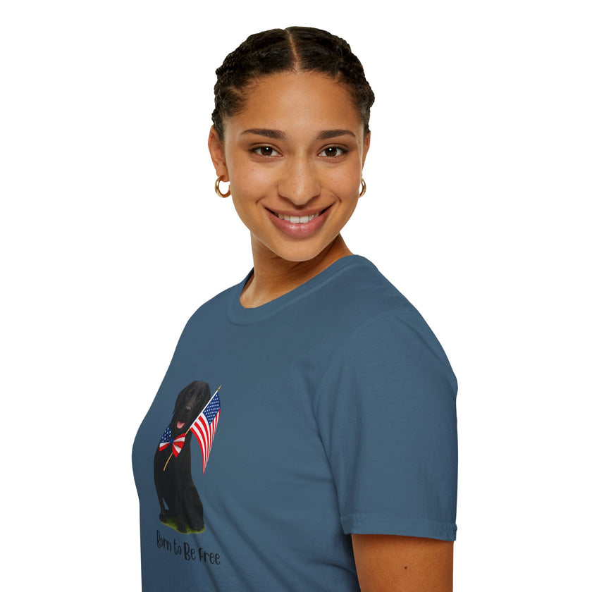 Indigo Blue t-shirt featuring a patriotic Black Lab wearing an American flag bowtie and holding U.S. flags, with the Black Lab phrase "Born to Be Free" printed below — perfect for dog lovers and patriotic Americans.