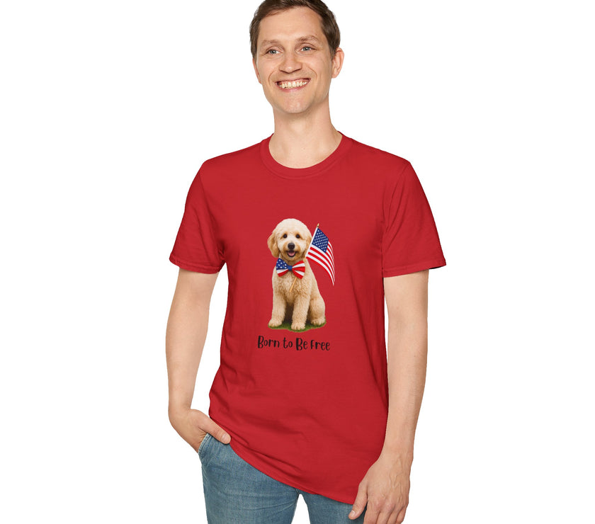 Male wearing T-shirt featuring a cute golden doodle puppy wearing an American flag bow tie and holding a small U.S. flag, with the phrase 'Born to Be Free' printed below the image.