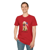 Male wearing T-shirt featuring a cute golden doodle puppy wearing an American flag bow tie and holding a small U.S. flag, with the phrase 'Born to Be Free' printed below the image.