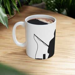 White ceramic mug featuring a silhouette of a child holding a fishing rod next to an adult figure, with the words "Happy Father's Day" in gold script above—an ideal gift for dads who love fishing and family time.