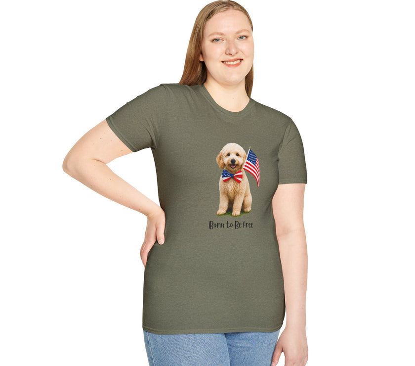 Female wearing T-shirt featuring a cute golden doodle puppy wearing an American flag bow tie and holding a small U.S. flag, with the phrase 'Born to Be Free' printed below the image.