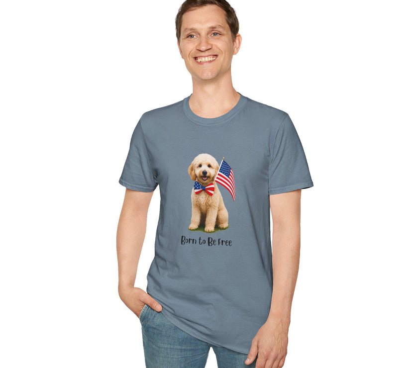 Male wearing T-shirt featuring a cute golden doodle puppy wearing an American flag bow tie and holding a small U.S. flag, with the phrase 'Born to Be Free' printed below the image.