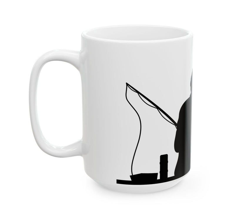 White ceramic mug featuring a silhouette of a child holding a fishing rod next to an adult figure, with the words "Happy Father's Day" in gold script above—an ideal gift for dads who love fishing and family time.