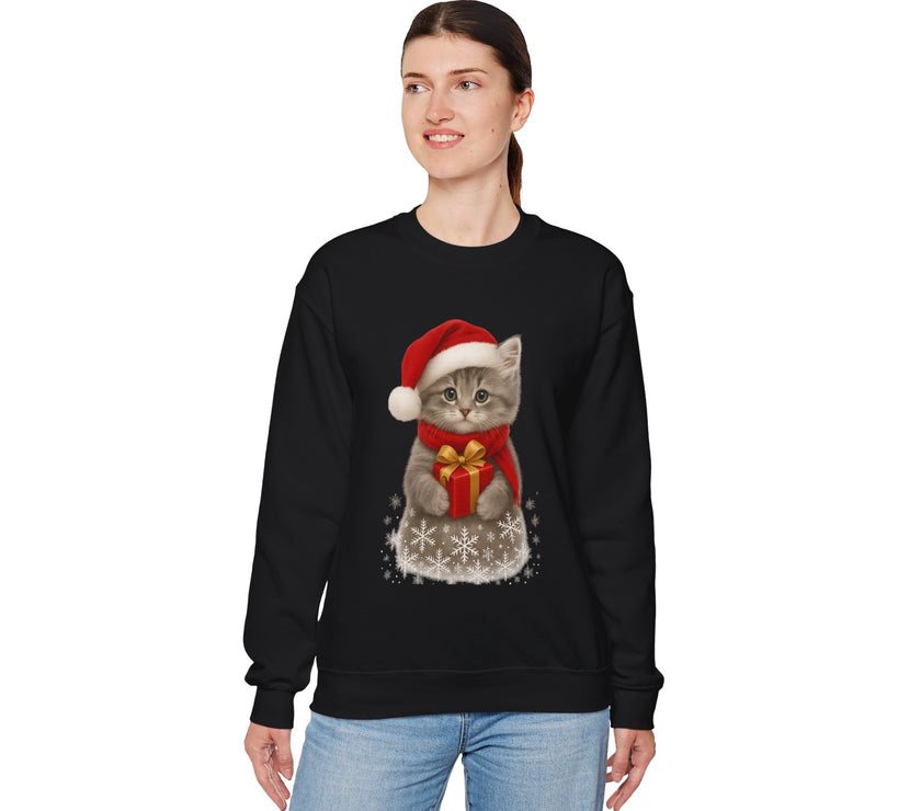 Black sweatshirt featuring a gray kitten wearing a Santa hat and red scarf, holding a small red gift box with a gold bow, surrounded by snowflake designs.