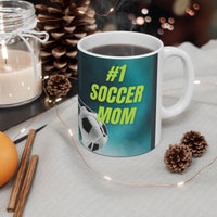 Mug with '#1 Soccer Mom' text and soccer ball design on a teal background