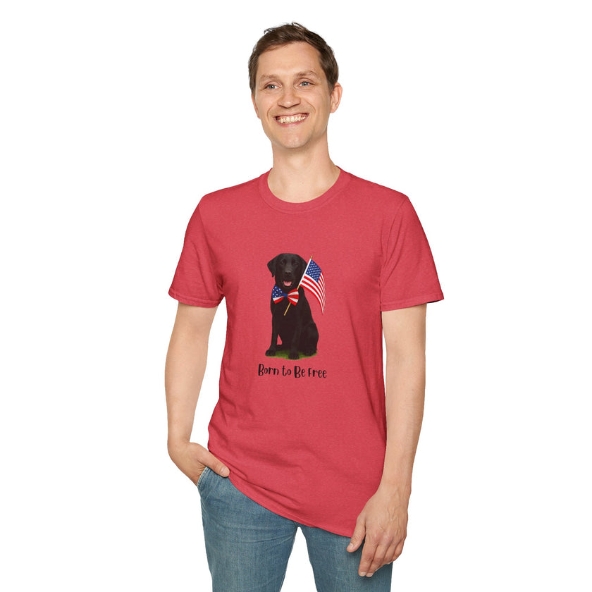 Heather Red  t-shirt featuring a patriotic Black Lab wearing an American flag bowtie and holding U.S. flags, with the Black Lab phrase "Born to Be Free" printed below — perfect for dog lovers and patriotic Americans.