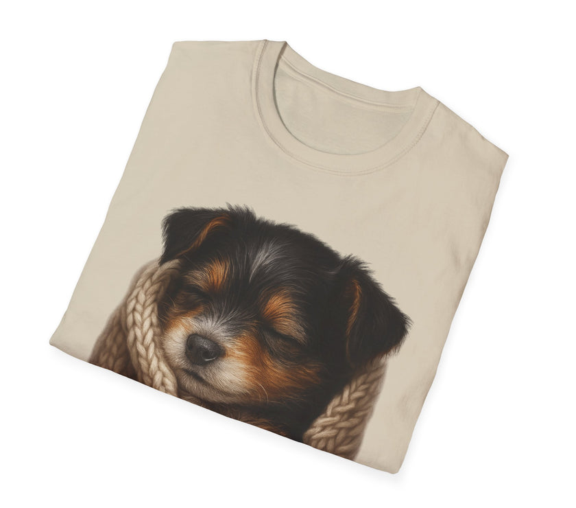 Folded beige t-shirt with a puppy design on a white background