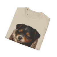 Folded beige t-shirt with a puppy design on a white background