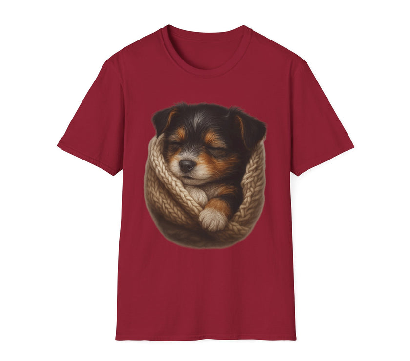 Red t-shirt with a graphic of a sleeping puppy in a knitted blanket on a white background
