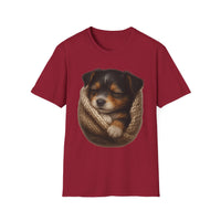 Red t-shirt with a graphic of a sleeping puppy in a knitted blanket on a white background