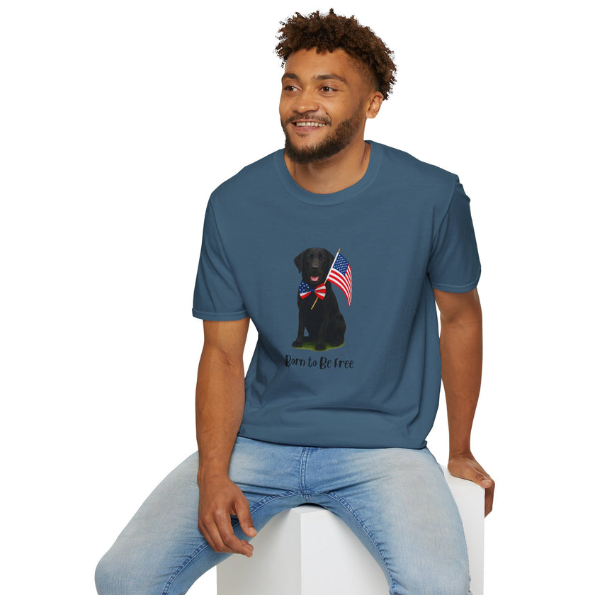 Indigo Blue t-shirt featuring a patriotic Black Lab wearing an American flag bowtie and holding U.S. flags, with the Black Labphrase "Born to Be Free" printed below — perfect for dog lovers and patriotic Americans.