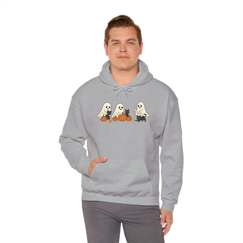 Man wearing a gray hoodie with Halloween-themed design on a white background
