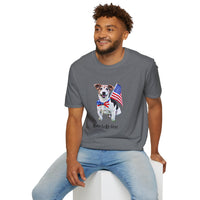 Male wearing T-shirt featuring a cute golden doodle puppy wearing an American flag bow tie and holding a small U.S. flag, with the phrase 'Born to Be Free' printed below the image.