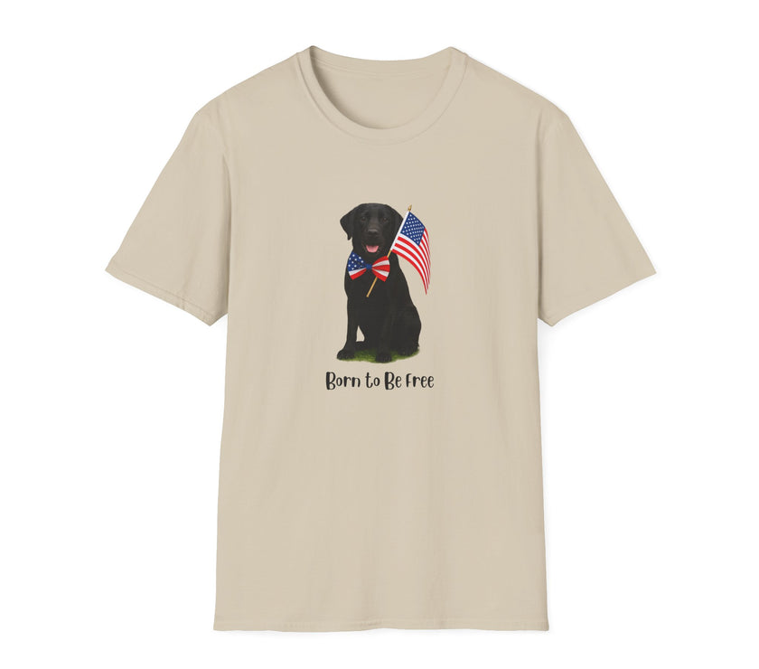 Sand t-shirt featuring a patriotic Black Lab wearing an American flag bowtie and holding U.S. flags, with the Black Labphrase "Born to Be Free" printed below — perfect for dog lovers and patriotic Americans.