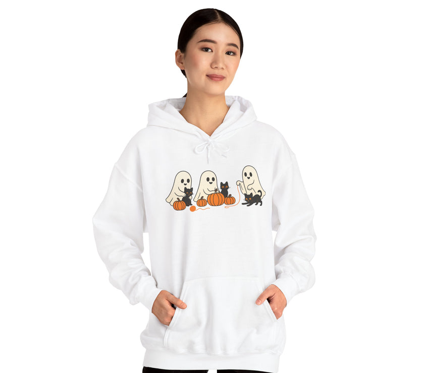 Person wearing a white hoodie with Halloween-themed design on a white background
