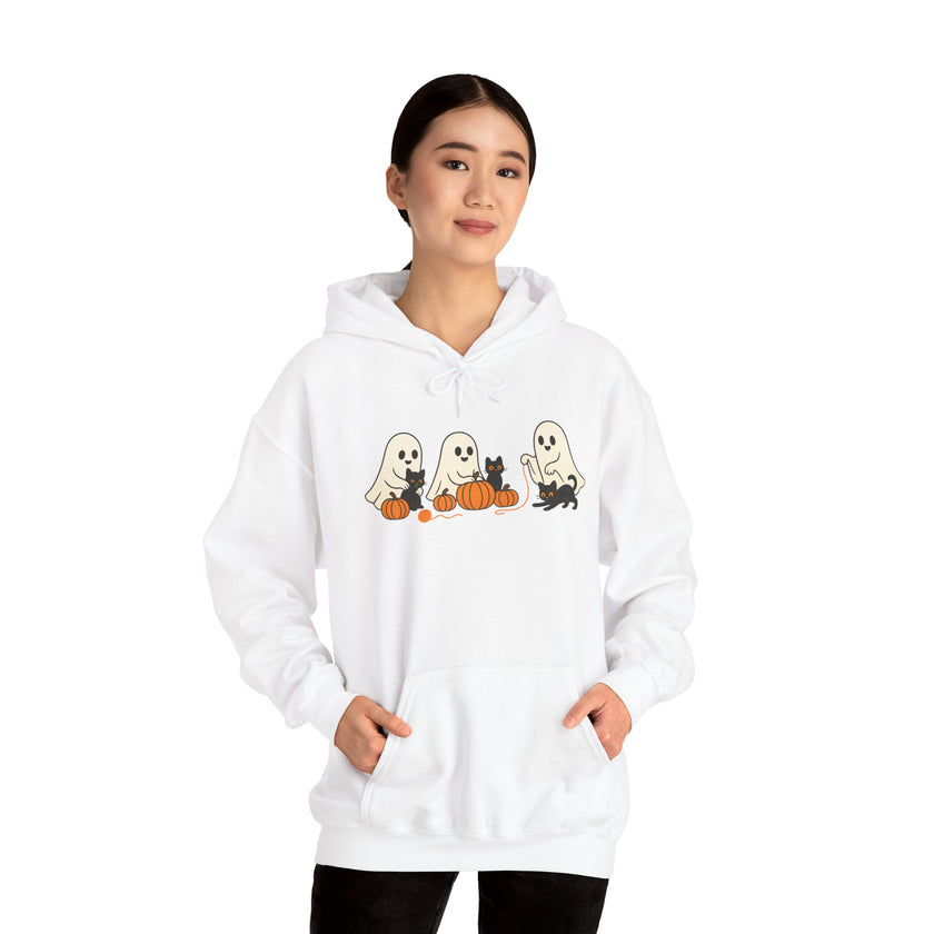Person wearing a white hoodie with Halloween-themed design on a white background