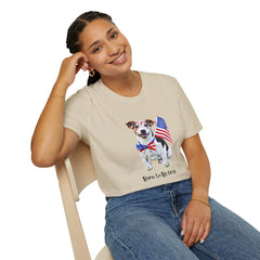 Female wearing T-shirt featuring a cute  puppy wearing an American flag bow tie and holding a small U.S. flag, with the phrase 'Born to Be Free' printed below the image.